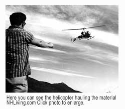 Helicopter hauls materials and comes in for landing